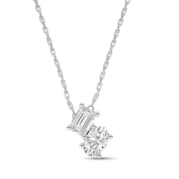 Close-up profile of a woman wearing the Two Entwined Souls white gold lab-grown diamond necklace while gently touching her hair