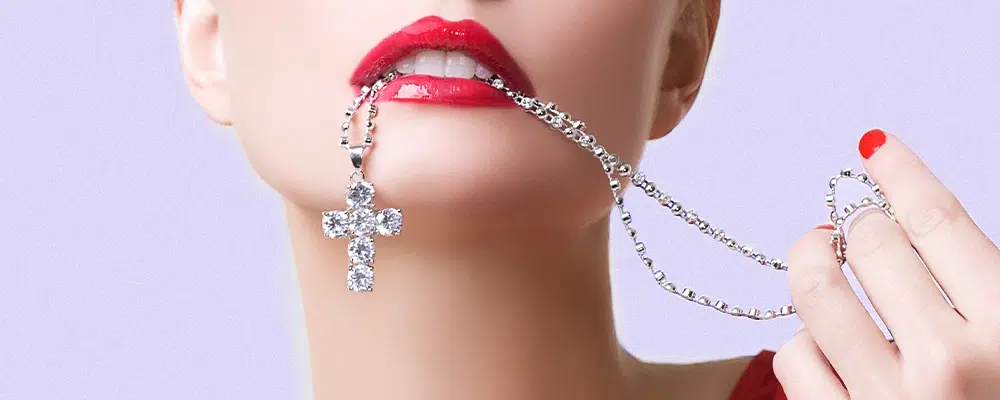 Lab-grown diamond cross pendant necklace with bezel-set chain in white gold.