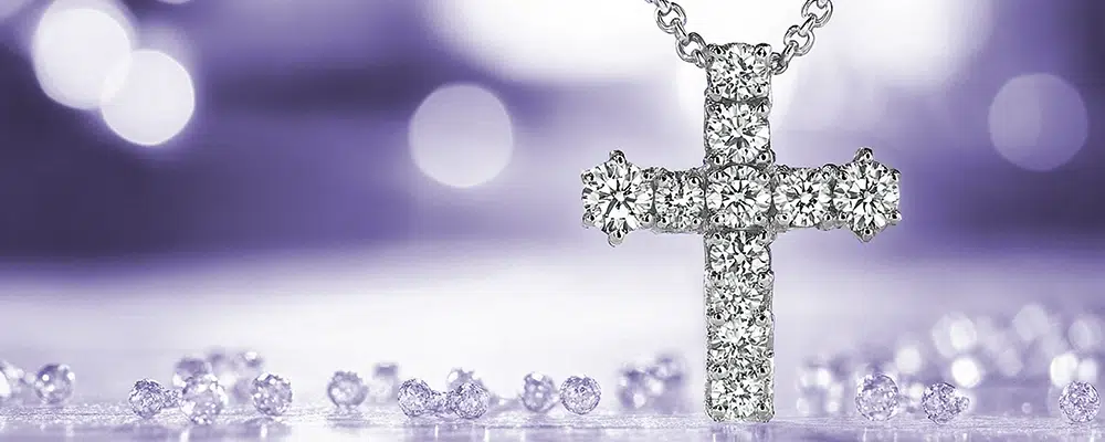 Round brilliant lab-grown diamond cross pendant necklace in white gold.
