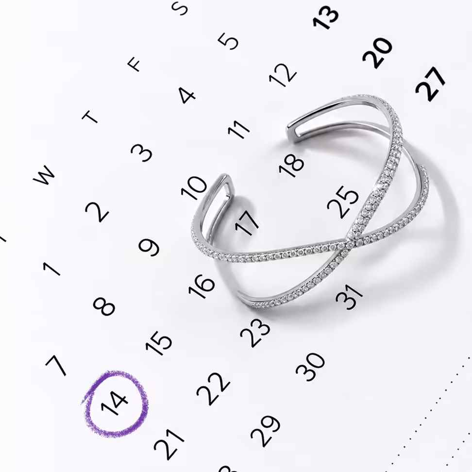 Silver diamond cuff bracelet resting on a calendar grid marked monday with a purple market - Cyber Monday jewelry deals and gifts