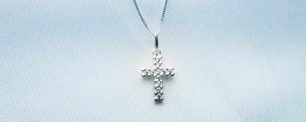 Round brilliant lab-grown diamond cross pendant necklace in 14k white gold.