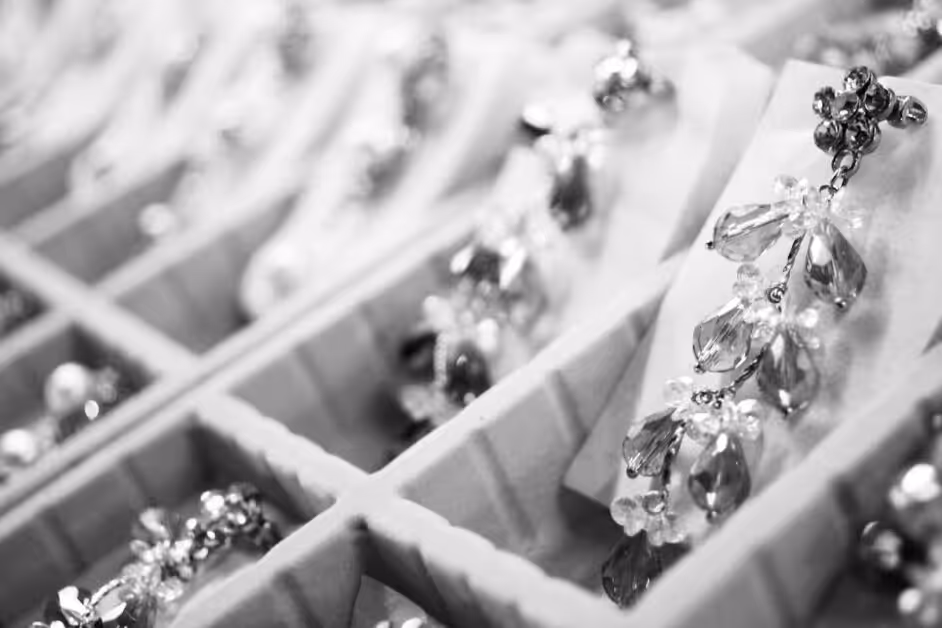A bunch of diamond jewelry in black and white