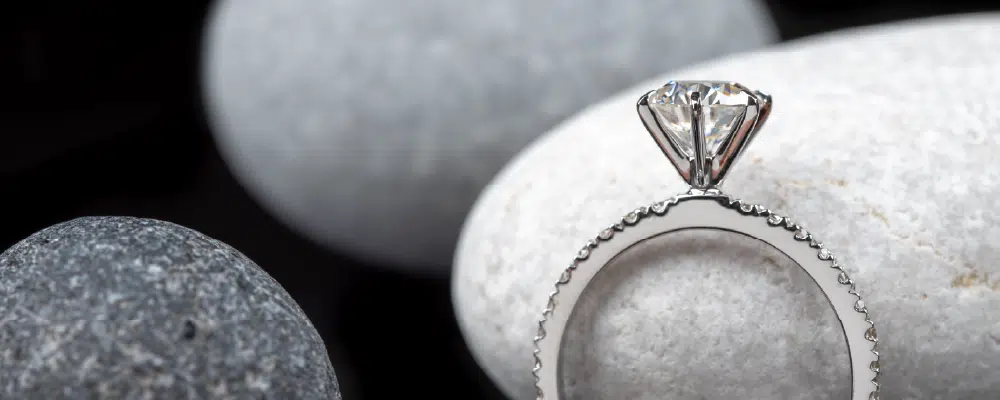 Round brilliant lab-grown diamond engagement ring with pavé band in 14k white gold.