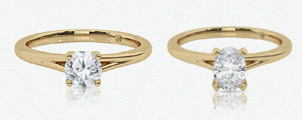 Side-by-side comparison of a round brilliant cut and an oval solitaire engagement ring, demonstrating how the elongated oval shape maximizes carat appearance.