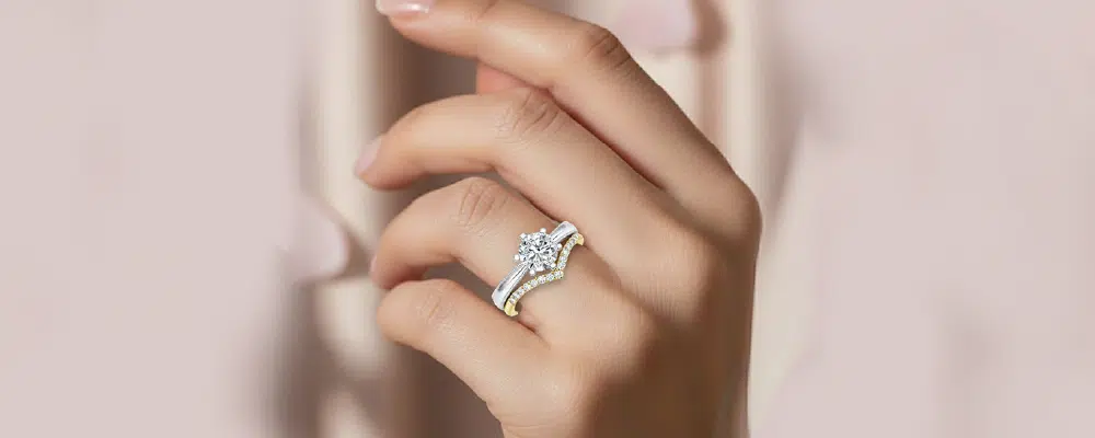 How to pair a white gold solitaire engagement ring with a yellow gold chevron diamond wedding band for a trendy mixed metal stack