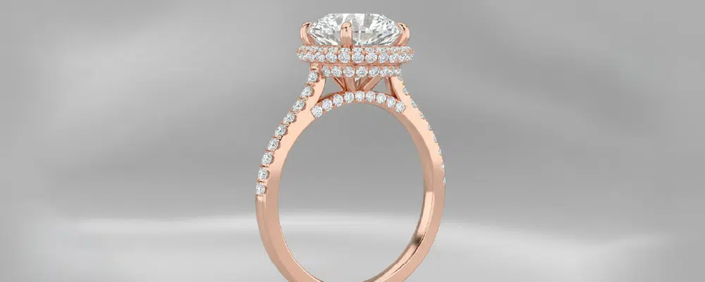 Side profile view of a rose gold double halo engagement ring with a micro-pavé band