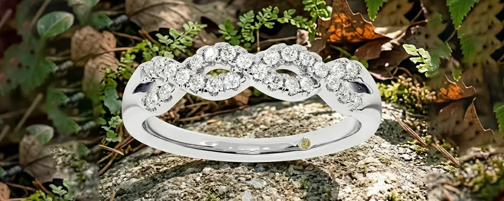 Round brilliant lab-grown diamond twisted infinity wedding band in white gold.
