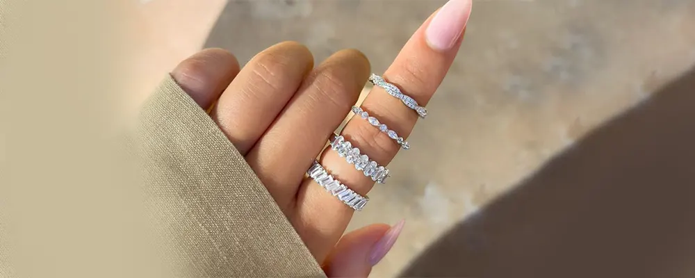 Stacked mixed-cut lab-grown diamond eternity bands in white gold.