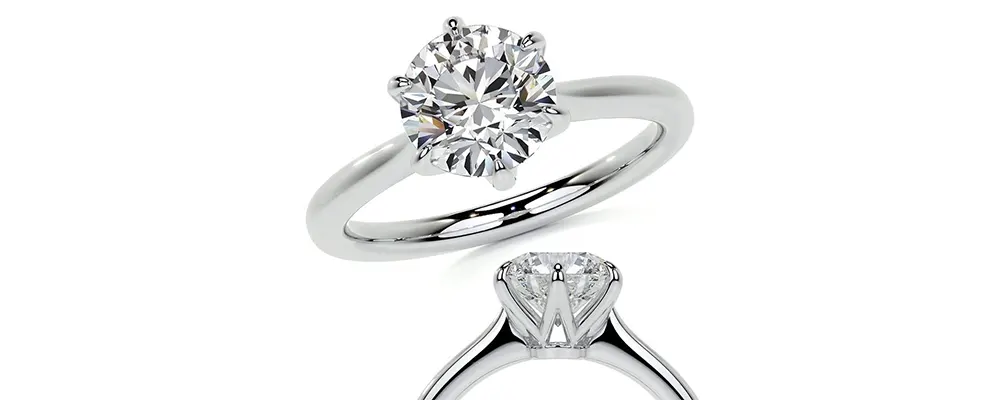 Top view and side profile of a classic six prong solitaire engagement ring setting in white gold with a round diamond