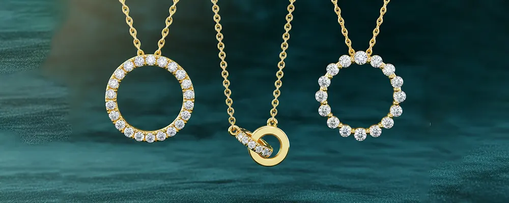 Three open circle and interlocking lab-grown diamond pendant necklaces in 18k yellow gold.