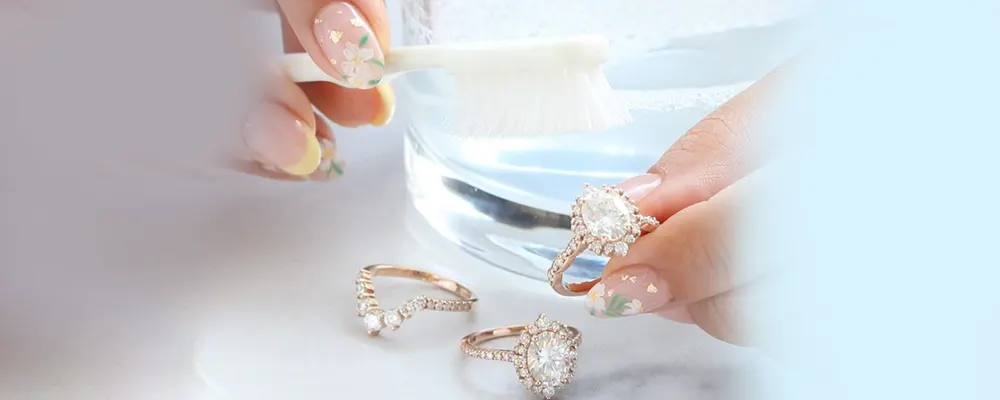 A close up of deep cleaning rose gold diamond engagement rings and a matching pave wedding band with a soft bristle brush