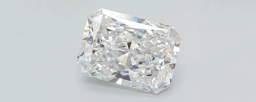 Loose rectangular radiant cut diamond close up showcasing the brilliance facets and cropped corners that provide maximum fire and durability