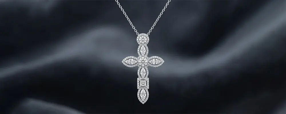 An architectural white gold cross pendant combining mixed diamond shapes including marquise, round, and princess cuts within a delicate halo border.