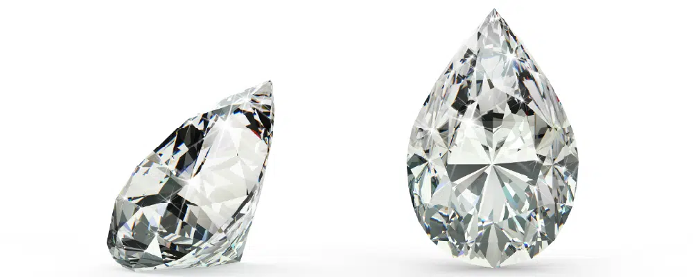 Loose pear cut diamonds viewed from the side and top down to show the unique teardrop shape and facet design symbolizing tears of joy