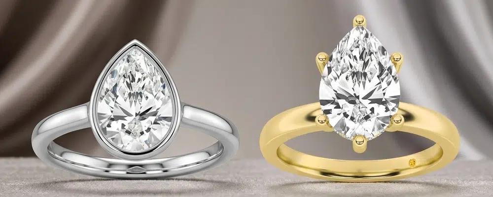 Side by side comparison of a platinum bezel set pear ring next to a classic six prong yellow gold pear engagement ring