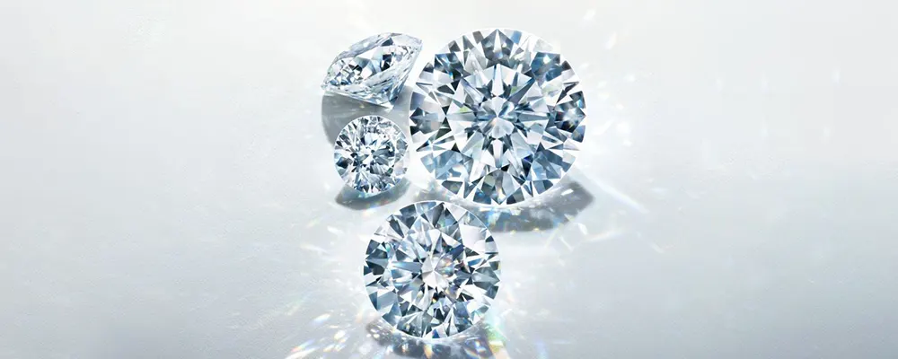 A collection of sparkling loose colorless round diamonds showing premium color grade purity.