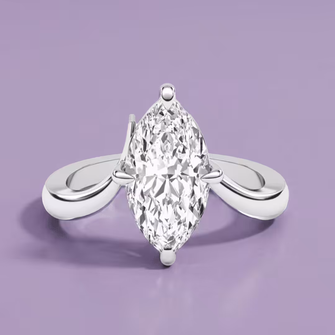 White gold solitaire engagement ring featuring a marquise-cut lab-grown diamond and a bypass shank design on a purple background.