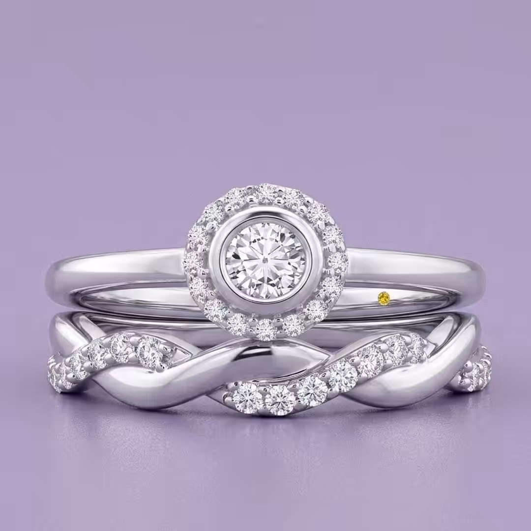 White gold promise ring set featuring a bezel-set round lab-grown diamond promise ring and a twisted diamond pavé band on a purple background.
